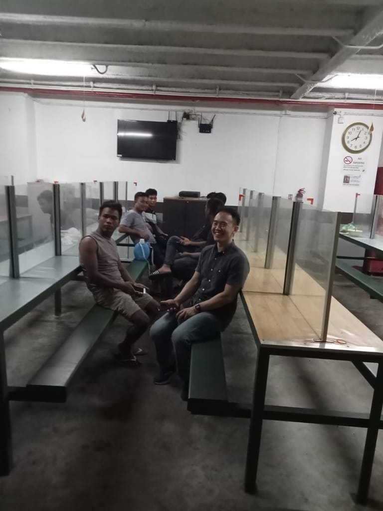 I, sitting in the canteen of the dormitory, just before the shower. 